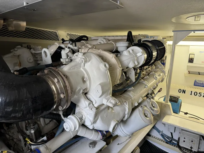  Yacht Photos Pics Engine room of a 1996 Viking 50 Convertible yacht, showcasing detailed machinery.