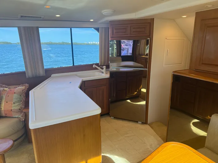  Yacht Photos Pics Interior of 1996 Viking 50 Convertible yacht with ocean view through large windows.