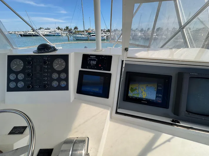  Yacht Photos Pics 1996 Viking 50 Convertible yacht cockpit with navigation instruments and ocean view.