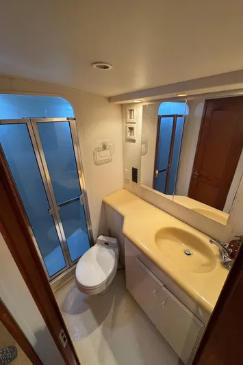  Yacht Photos Pics Bathroom interior of 1996 Viking 50 Convertible yacht with shower and vanity.