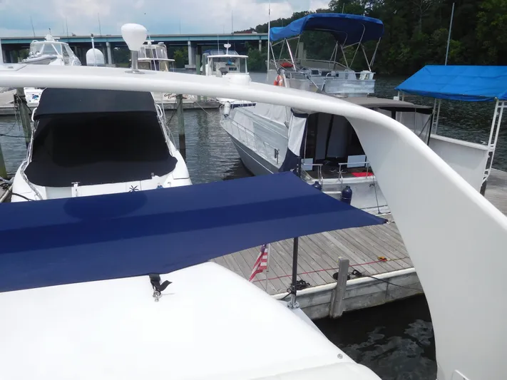  Yacht Photos Pics 2006 Carver 36 Mariner docked at marina with blue canopy.