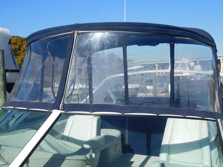  Yacht Photos Pics 2006 Carver 36 Mariner boat with clear enclosure and seating area.