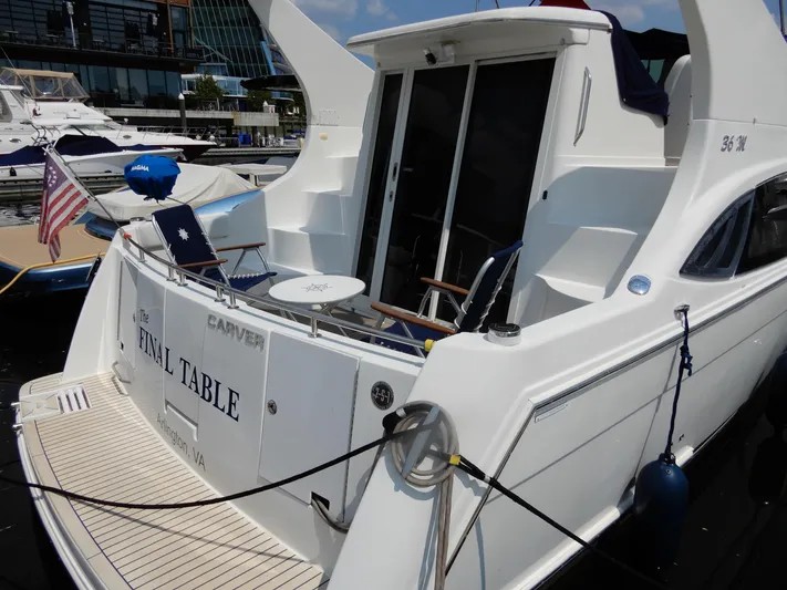  Yacht Photos Pics 2006 Carver 36 Mariner yacht docked, featuring spacious deck and elegant design.