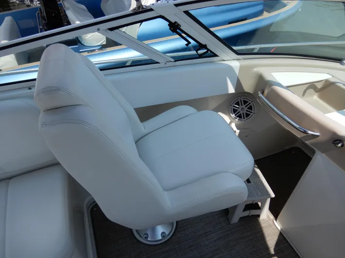  Yacht Photos Pics Captain's seat on a 2006 Carver 36 Mariner boat, featuring white upholstery and modern design.