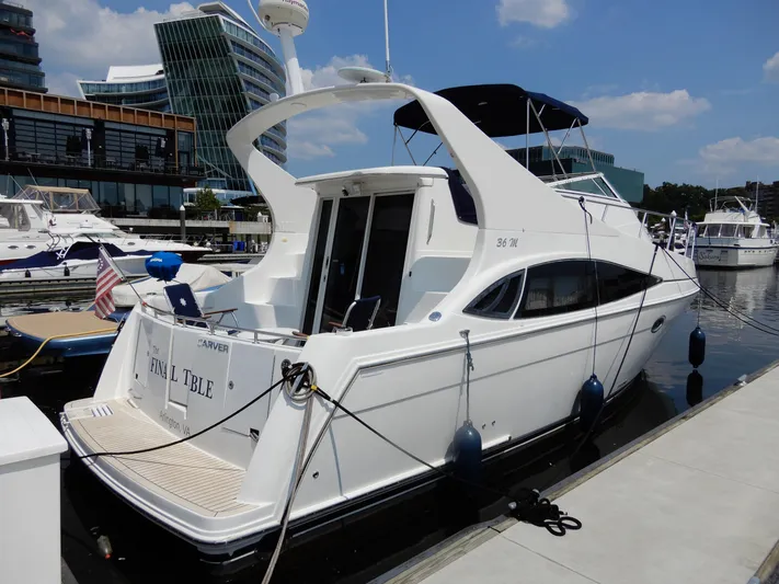  Yacht Photos Pics 2006 Carver 36 Mariner yacht docked at a marina, featuring sleek design and modern architecture.