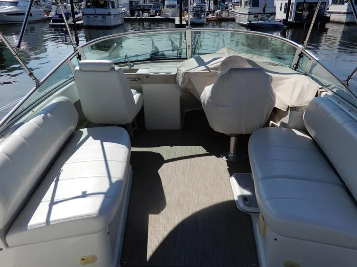  Yacht Photos Pics 2006 Carver 36 Mariner boat interior with white seating at a marina.