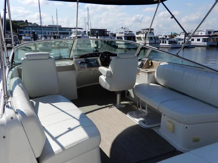  Yacht Photos Pics 2006 Carver 36 Mariner boat interior with white seating and helm, docked at marina.