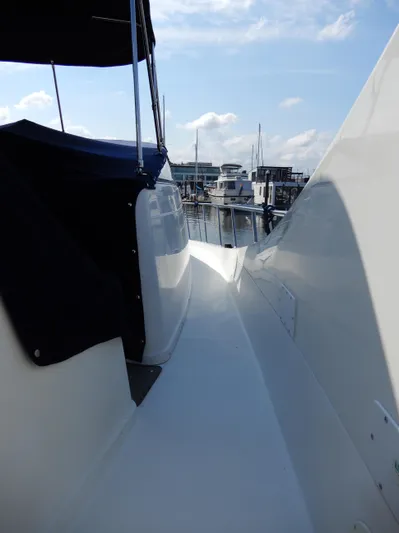  Yacht Photos Pics 2006 Carver 36 Mariner yacht deck view at marina, under clear sky.