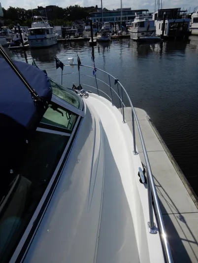 Yacht Photos Pics 2006 Carver 36 Mariner docked at a marina, view of the deck and railing.
