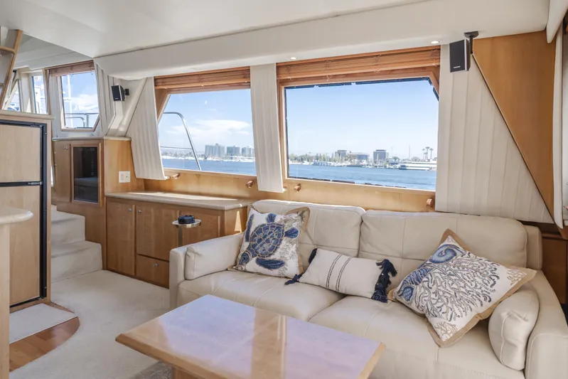 Love Life Yacht Photos Pics Luxurious 2007 Navigator Pilothouse yacht interior with plush seating and scenic ocean view.