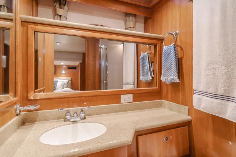 Love Life Yacht Photos Pics Luxurious 2007 Navigator Pilothouse bathroom with wood accents and elegant fixtures.