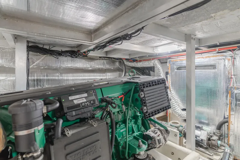 Love Life Yacht Photos Pics Engine room of a 2007 Navigator Pilothouse yacht, showcasing mechanical components and wiring.