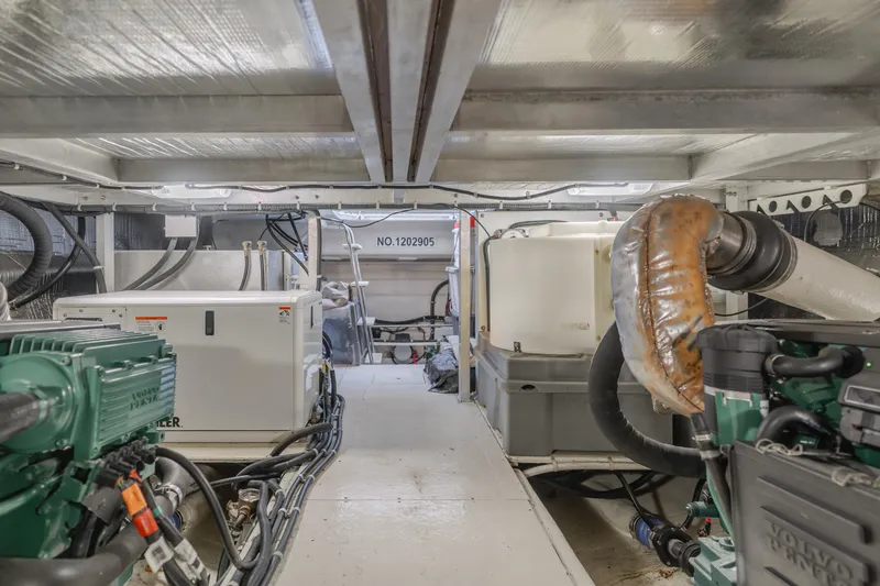 Love Life Yacht Photos Pics Engine room of a 2007 Navigator Pilothouse yacht, featuring machinery and equipment.