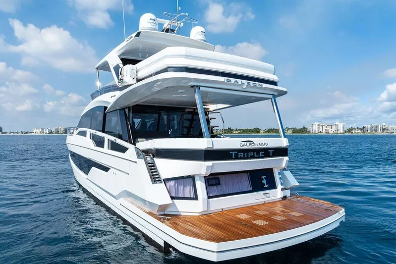 Triple T Yacht Photos Pics 2022 Galeon 640 Fly yacht on calm water, showcasing sleek design and luxury features.