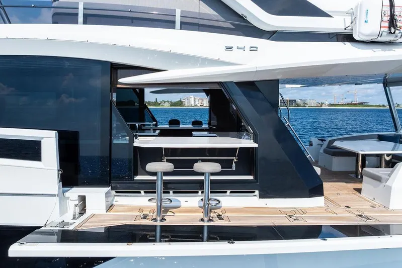 Triple T Yacht Photos Pics 2022 Galeon 640 Fly yacht with sleek design and modern outdoor seating area.