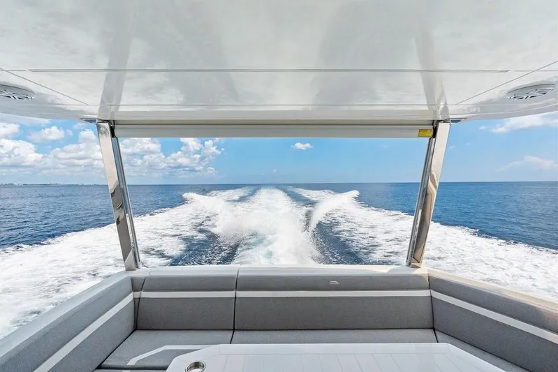 Triple T Yacht Photos Pics Galeon 640 Fly 2022 yacht cruising on open sea, view from rear deck.