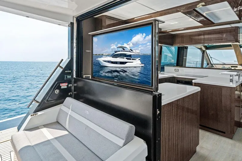 Triple T Yacht Photos Pics Luxurious interior of 2022 Galeon 640 Fly yacht with ocean view and modern amenities.