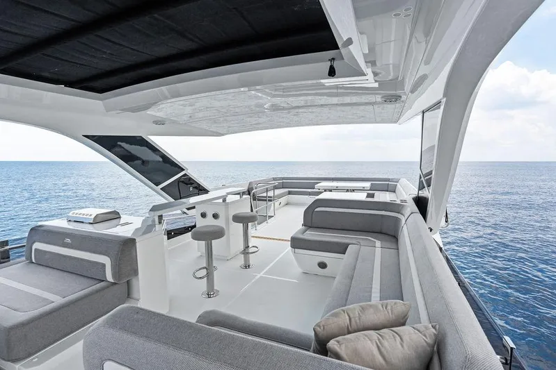 Triple T Yacht Photos Pics Luxurious 2022 Galeon 640 Fly yacht deck with modern seating and ocean view.