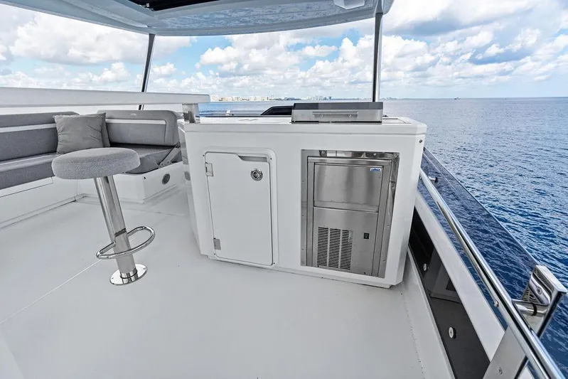 Triple T Yacht Photos Pics Luxurious 2022 Galeon 640 Fly yacht deck with seating and ocean view.