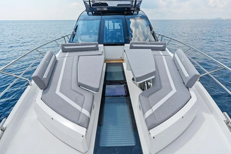Triple T Yacht Photos Pics Luxury 2022 Galeon 640 Fly yacht with elegant deck seating on open sea.
