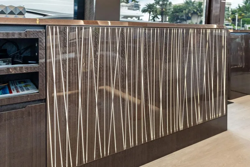 Triple T Yacht Photos Pics Luxurious interior detail of 2022 Galeon 640 Fly yacht with modern wood paneling.