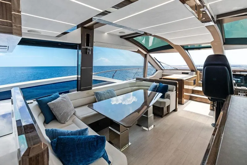 Triple T Yacht Photos Pics Luxurious interior of 2022 Galeon 640 Fly yacht with ocean view and modern furnishings.