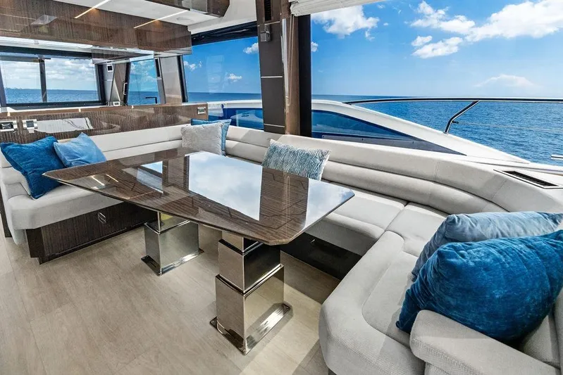 Triple T Yacht Photos Pics Luxurious interior of 2022 Galeon 640 Fly yacht with ocean view and plush seating.
