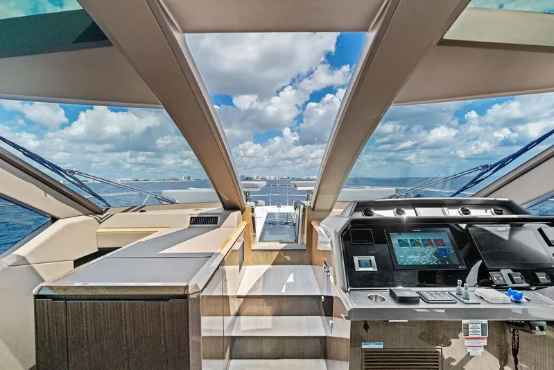 Triple T Yacht Photos Pics Luxurious interior of 2022 Galeon 640 Fly yacht with panoramic ocean view.