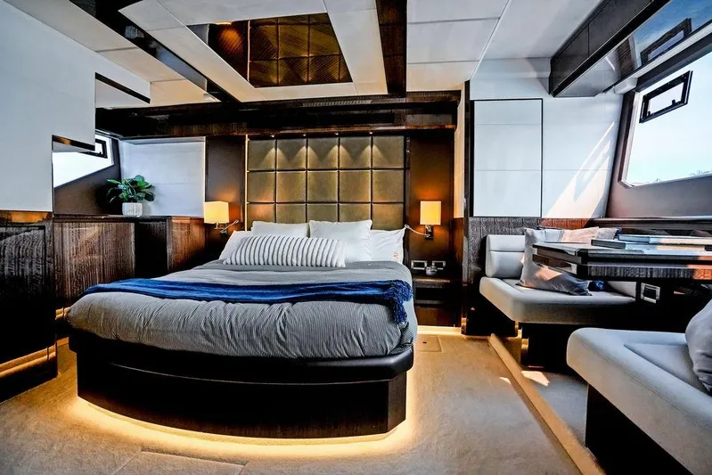 Triple T Yacht Photos Pics Luxurious bedroom interior of 2022 Galeon 640 Fly yacht with modern design and ambient lighting.