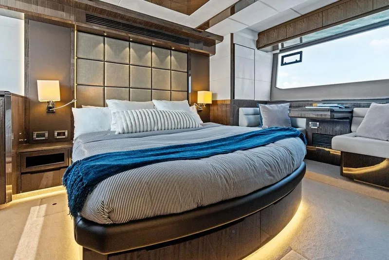 Triple T Yacht Photos Pics Luxurious bedroom interior of 2022 Galeon 640 Fly yacht with modern design and ambient lighting.