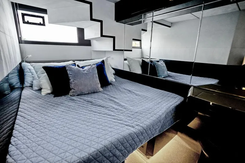 Triple T Yacht Photos Pics Luxurious bedroom interior of 2022 Galeon 640 Fly yacht with modern design and plush bedding.