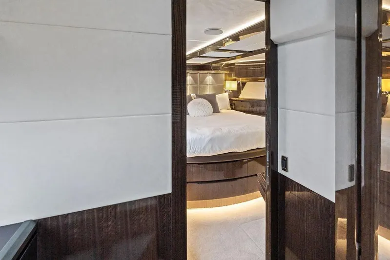 Triple T Yacht Photos Pics Luxurious bedroom interior of 2022 Galeon 640 Fly yacht with modern design and ambient lighting.