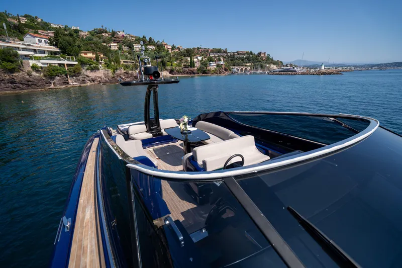  Yacht Photos Pics Luxurious 2015 Riva 63 Virtus yacht cruising near scenic coastline.