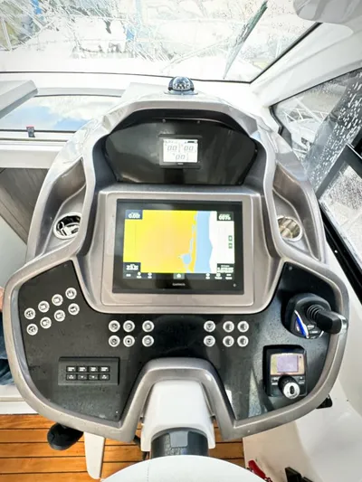  Yacht Photos Pics 2024 Sessa Marine C36 OB boat dashboard with navigation display and controls.