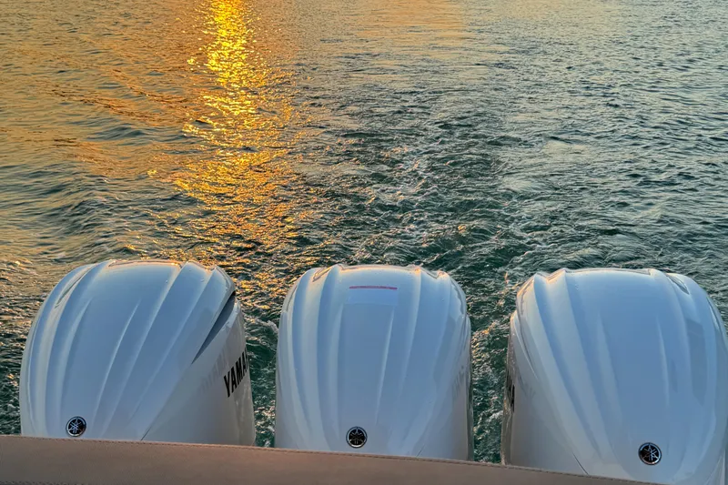  Yacht Photos Pics 2024 Sessa Marine C36 OB with triple outboard engines at sunset on the water.