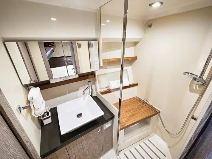  Yacht Photos Pics Luxurious bathroom in 2024 Sessa Marine C36 OB yacht with modern fixtures.