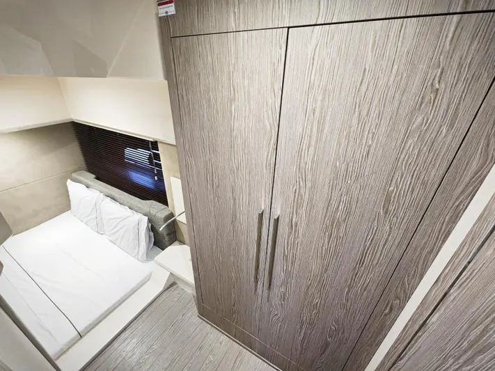  Yacht Photos Pics 2024 Sessa Marine C36 OB cabin interior with modern wood finish and cozy bed.
