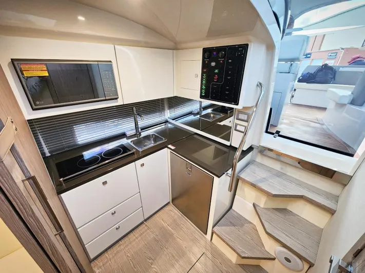  Yacht Photos Pics Modern kitchen interior of 2024 Sessa Marine C36 OB yacht with sleek design and appliances.