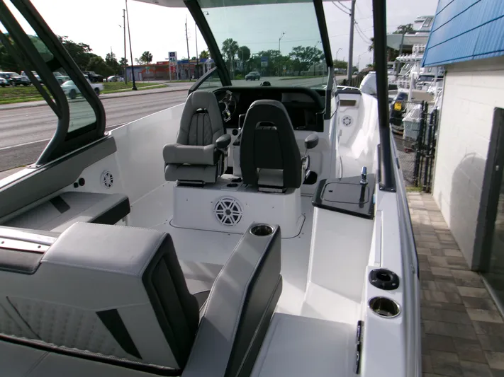  Yacht Photos Pics 2025 Monterey Elite 27 OB boat interior with modern seating and dashboard.