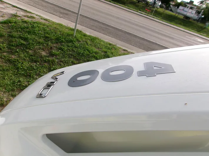  Yacht Photos Pics Close-up of 2025 Monterey Elite 27 OB boat model number on white surface.