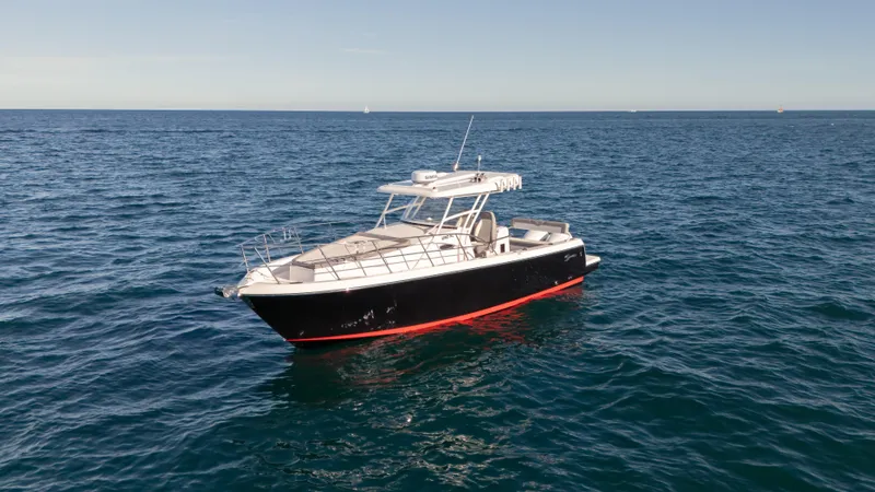  Yacht Photos Pics 2025 SeaWell 290XL boat on open ocean, clear sky, calm waters.