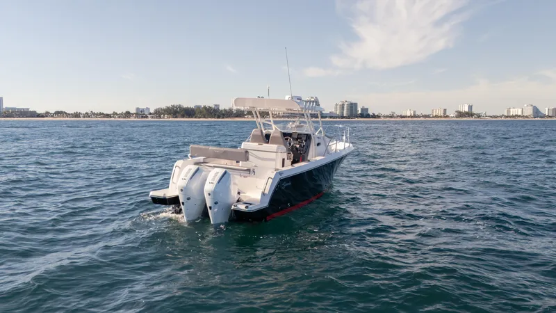  Yacht Photos Pics 2025 SeaWell 290XL boat cruising on open water with twin engines.