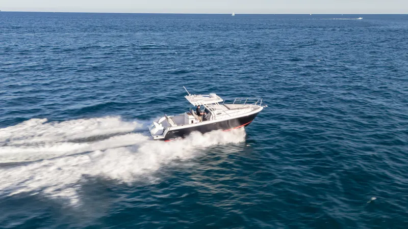  Yacht Photos Pics 2025 SeaWell 290XL boat speeding on open ocean waters.