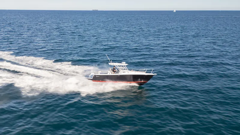  Yacht Photos Pics 2025 SeaWell 290XL boat cruising on open ocean waters.