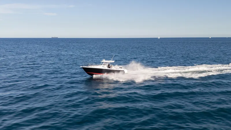 Yacht Photos Pics 2025 SeaWell 290XL speedboat cruising on open ocean under clear blue sky.