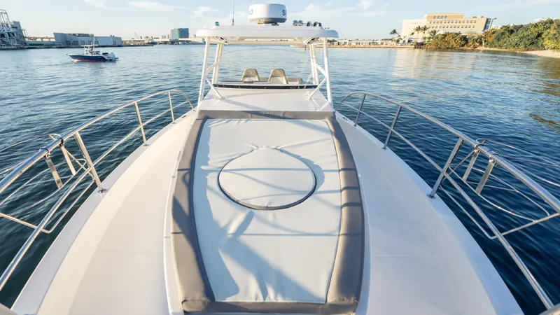  Yacht Photos Pics 2025 SeaWell 290XL yacht on calm water, featuring spacious deck and modern design.