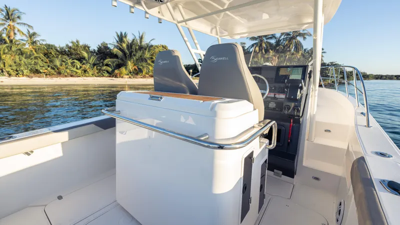  Yacht Photos Pics Modern SeaWell 290XL boat interior, 2025 model, near tropical shoreline.