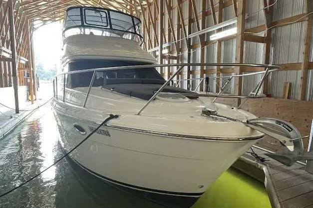 One Life Yacht Photos Pics 2004 Meridian 341 yacht docked in a wooden boathouse.