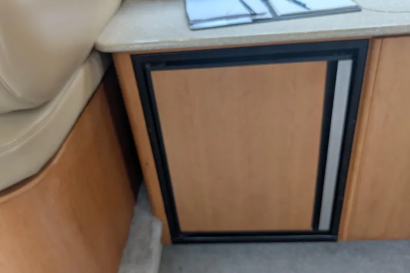 One Life Yacht Photos Pics Wooden cabinet door in 2004 Meridian 341 interior, adjacent to beige seating.