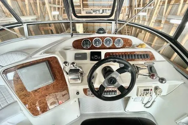 One Life Yacht Photos Pics Helm of 2004 Meridian 341 yacht with steering wheel and control panel.
